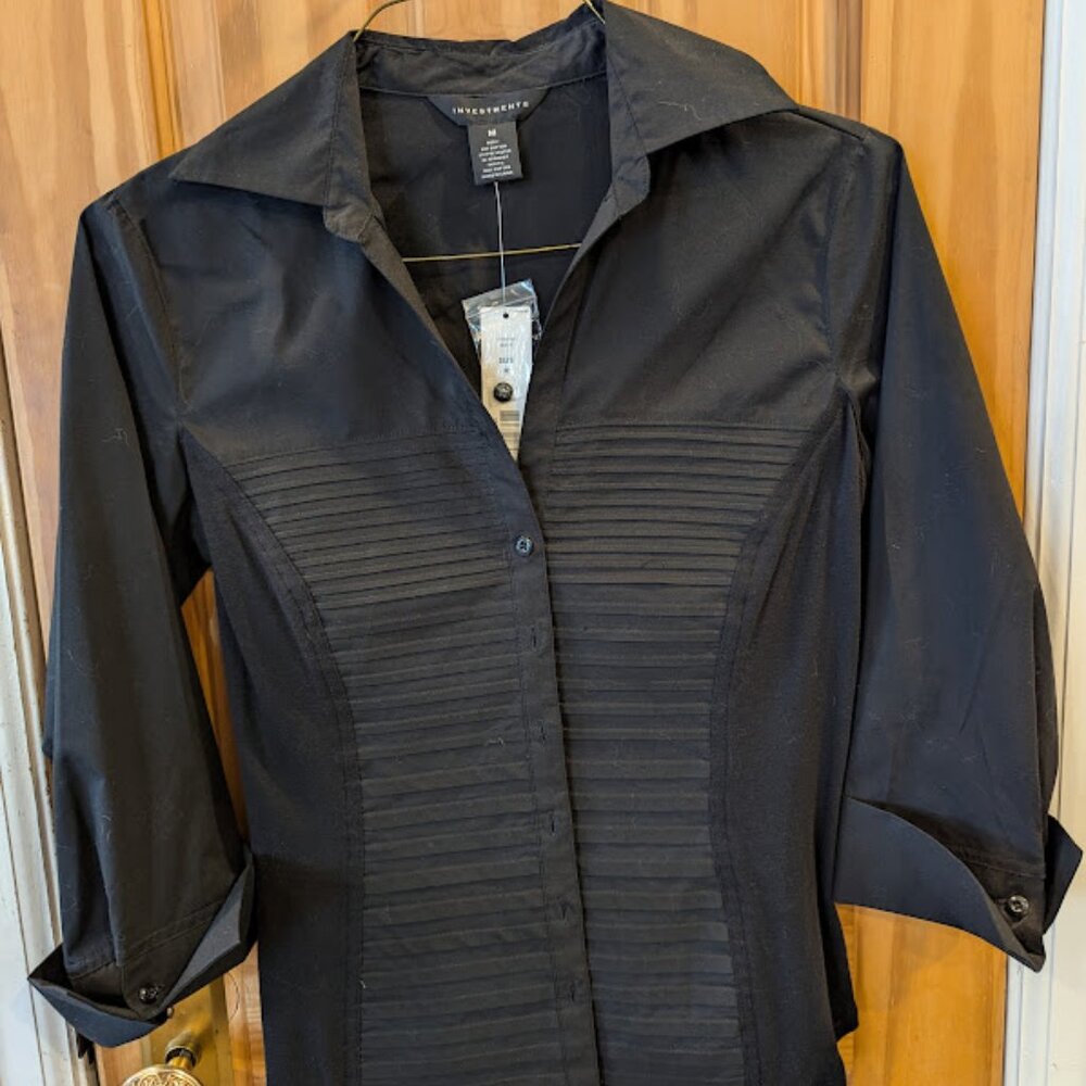 Black pleated, collared women's blouse.